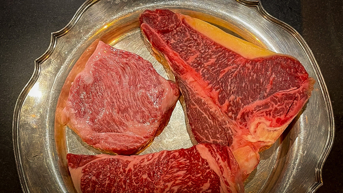 Dry aged meat on a silver plate
