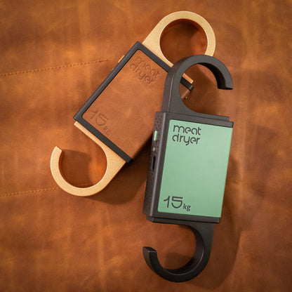 Meatdryer smart hooks with mobile app  on a brown leather background